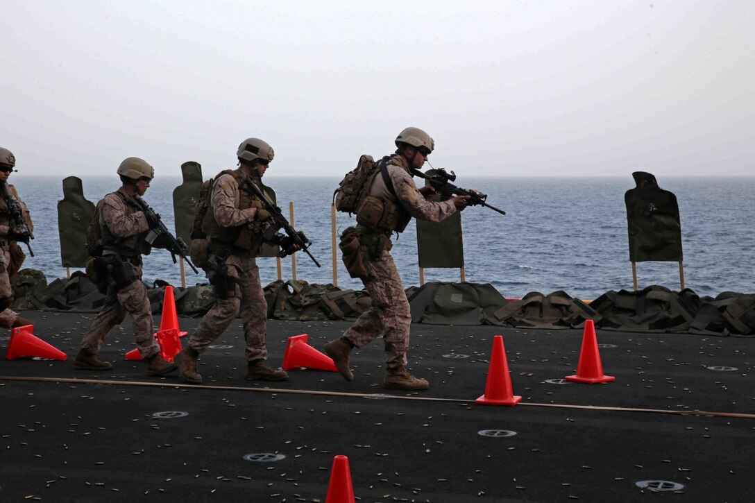 U.S. Marines assigned to Reconnaissance Platoon, Battalion Landing Team 1/4, 13th Marine Expeditionary Unit (MEU) conduct live fire training aboard the USS Boxer (LHD 4) at sea Jan. 8, 2014. The 13th MEU is deployed with the Boxer Amphibious Ready Group as a theater reserve and crisis response force throughout the U.S. 5th Fleet area of responsibility. (U.S. Marine Corps photo by Cpl. David Gonzalez, 13th Marine Expeditionary Unit Combat Camera/Released)