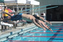 Air Force wounded warriors compete in a swim meet during the inaugural Wounded Warrior Pacific Invitational in Honolulu, Hawaii, Jan. 9, 2014.   The race is part of the adaptive athletic reconditioning program which helps wounded warriors build strength and endurance, while they draw inspiration from their teammates. All enrollees in Air Force Wounded Warriors program are encouraged to make athletics an essential part of their recovery, rehabilitation and rehabilitation plans. (U.S. Air Force photo/Master Sgt. Matthew McGovern)