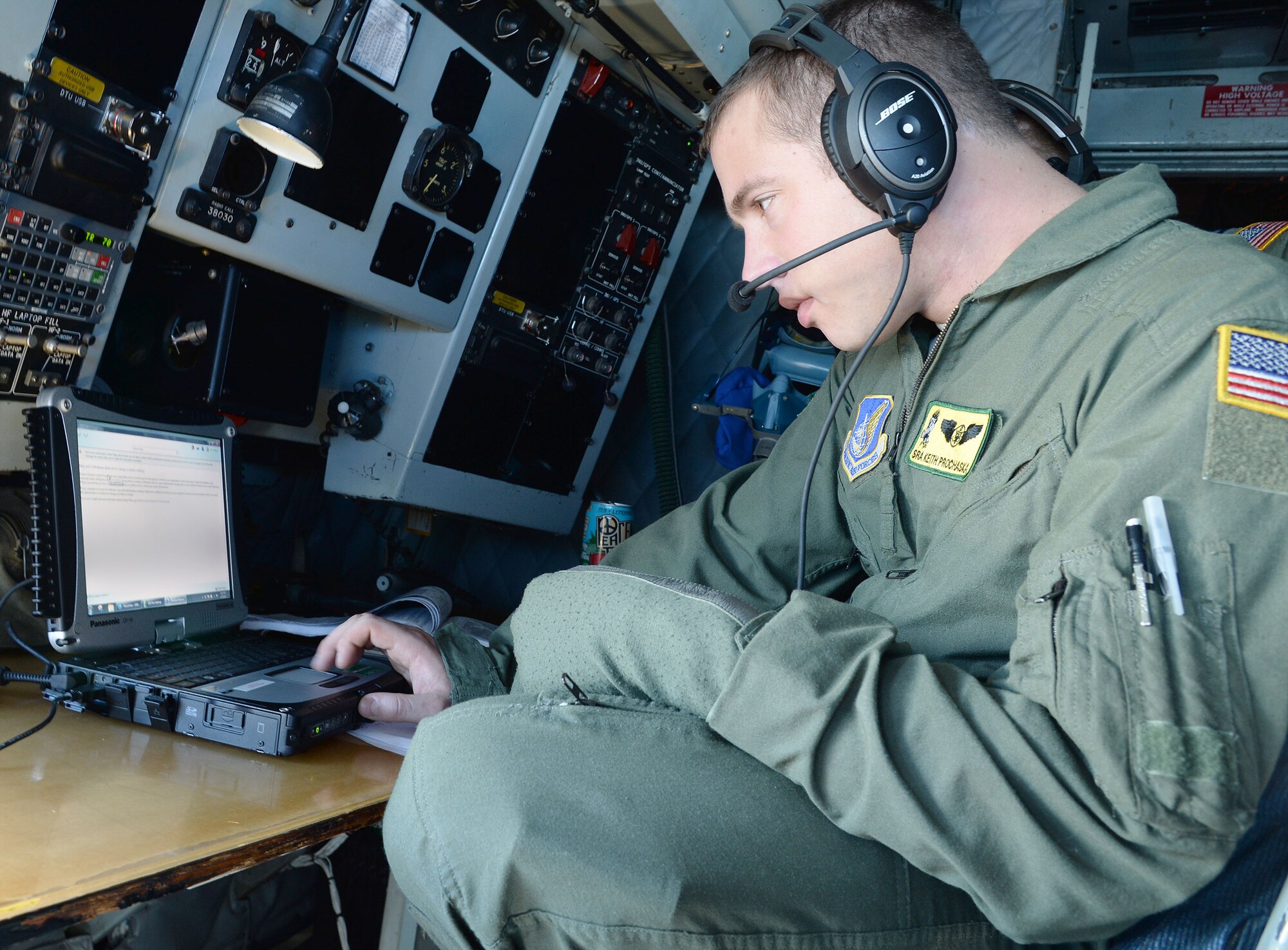 Senior Airman Keith Prochaska, 96th Air Refueling Squadron, ensures the aircraft’s GPS system is working correctly before takeoff aboard a KC-135 Stratotanker at Joint Base Pearl Harbor-Hickam, Hawaii, Jan. 10, 2014. Prochaska, a boom operator, was a participant in the Inaugural Total Force Integration Warrior Day, a training event that tested the cooperation and capabilities of multiple base agencies. The training highlighted the importance of integrating operations of active duty, Hawaii National Guard and Air Force Reserve units. (U.S. Air Force photo/Staff Sgt. Alexander Martinez)