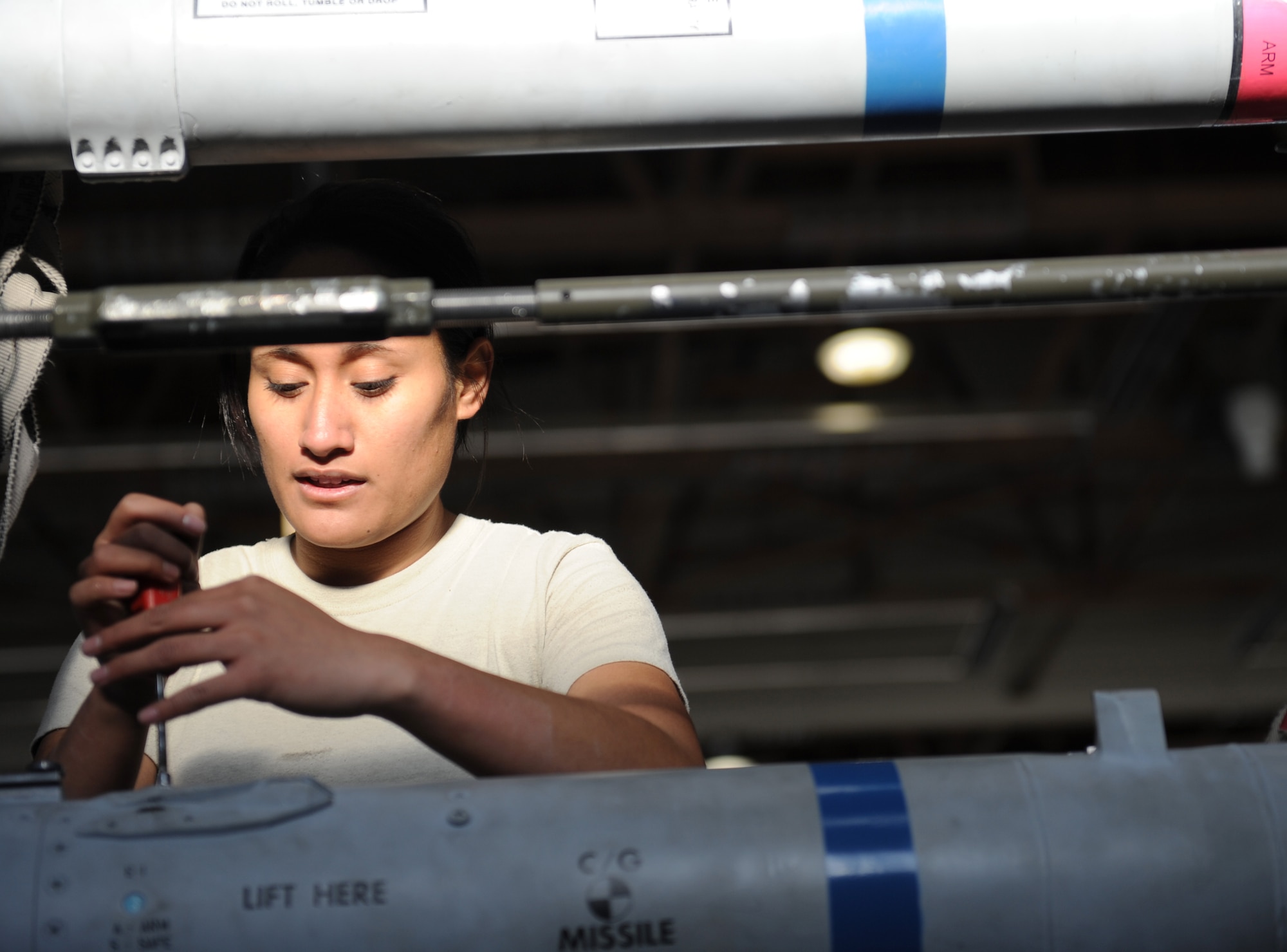 U.S. Air Force Airman 1st Class Logo Maafala, 389th Fighter Squadron weapon load crew member, inspects a GBU-12 training munition at Mountain Home Air Force Base, Idaho, Jan. 7, 2013. Maafala, along with two other Airmen in the three-man crew, competed in the annual Load Crew of the Year Competition. (U.S. Air Force photo by Airman 1st Class Brittany A. Chase/Released)