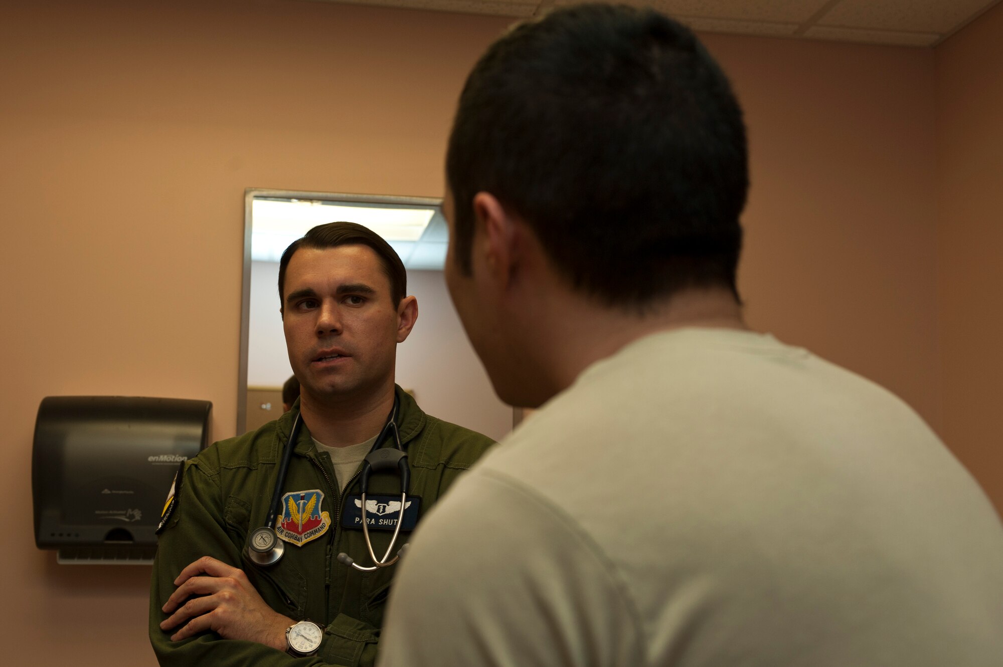 U.S. Air Force Capt. (Dr.) Thomas Shute, 42nd Attack Squadron flight surgeon, explains common hearing problems to Senior Airman Phou Johnson, 757th Aircraft Maintenance Squadron avionics technician, during a follow-up occupational health exam Jan. 10, 2014, at Nellis Air Force Base, Nev. Without the proper use of hearing protection the hazardous noise levels reached on the flight line can damage an Airman’s hearing. (U.S. Air Force photo/Airman 1st Class Timothy Young)