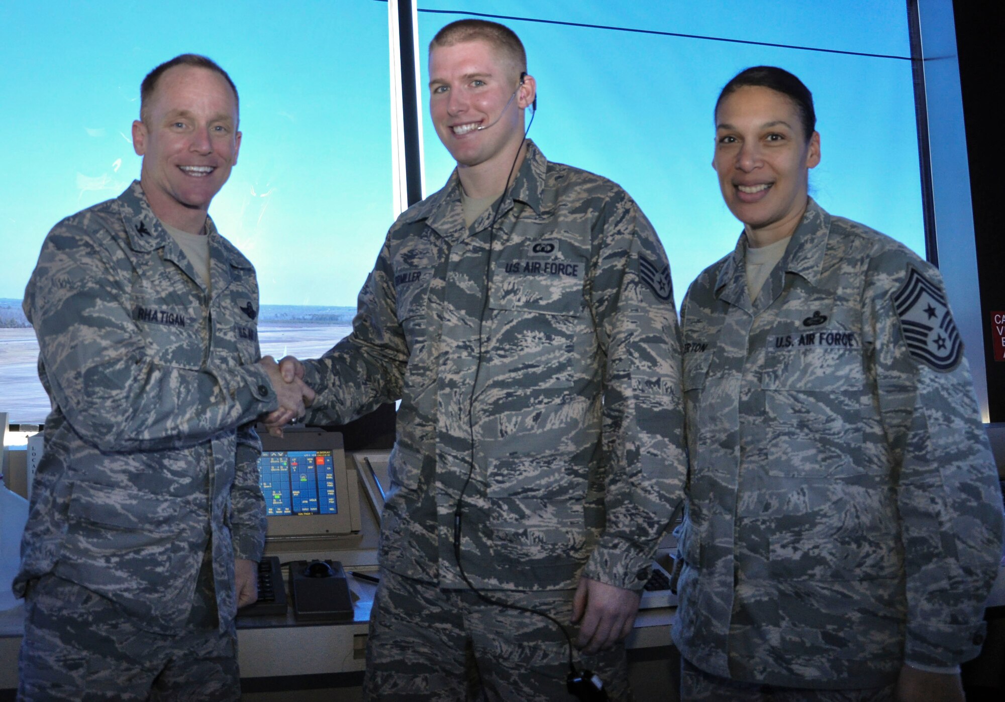 Staff Sgt. William Formiller, a 19th Operations Support Squadron Air Traffic Control Tower journeyman (binoculars), along with two other 19th OSS Air Traffic Control Tower journeymen, search for and try to establish communication with distant aircraft Dec. 23, 2013, at Little Rock Air Force Base, Ark. Formiller, a Hudson, Wisc., native, was also the distinguished graduate for his Airman Leadership School class. (U.S. Air Force photo by Senior Airman Regina Agoha)