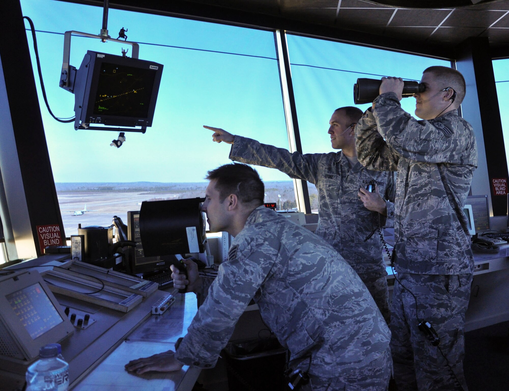 Col. Patrick Rhatigan, 19th Airlift Wing commander, along with Chief Master Sgt. Margarita Overton, 19th AW command chief, congratulate Staff Sgt. William Formiller, a 19th Operations Support Squadron Air Traffic Control Tower journeyman, for his selection as Combat Airlifter of the Week, Dec. 23, 2013, at Little Rock Air Force Base, Ark. Formiller was identified as the No.1 trainer during Air Mobility Command's first Unit Effectiveness Inspection. His contributions earned him a coin from AMC and he was dubbed an "Outstanding Performer.'' Formiller provides control instructions, clearances and traffic advisories for 1,700 aircrew, five MAJCOMS, and 114,000 safe operations for fiscal year 2013. (U.S. Air Force photo by Senior Airman Regina Agoha)