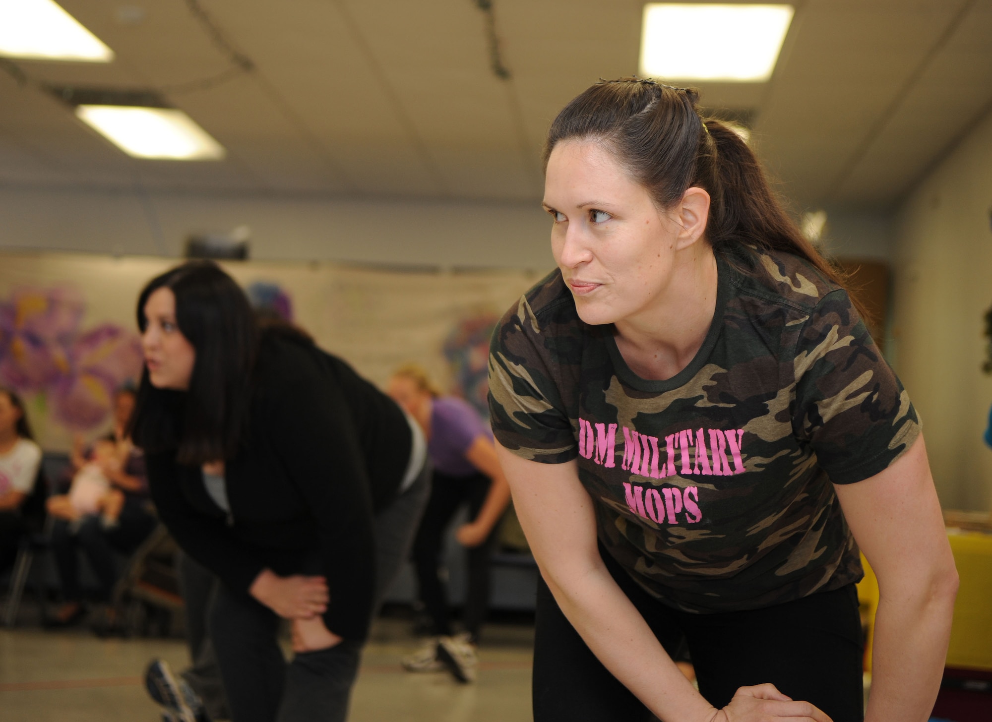 Mothers of Preschoolers take part in Turbo Kick during a MOPS meeting at Davis-Monthan Air Force Base, Ariz., Jan. 10, 2014. MOPS is a way mothers can get together and support each other while building a strong bond within their community. (U.S. Air Force photo by Senior Airman Camilla Elizeu/ Released)