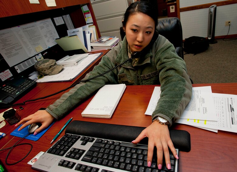 Airman 1st Class So Park, 22nd Comptroller Squadron financial services technician, provides an Airman with financial assistance over the phone Jan. 7, 2014, at McConnell Air Force Base, Kan. Park and the other Airmen in the 22nd CPTS support McConnell personnel with questions and concerns regarding their pay. (U.S. Air Force photo/Airman 1st Class Victor J. Caputo)
