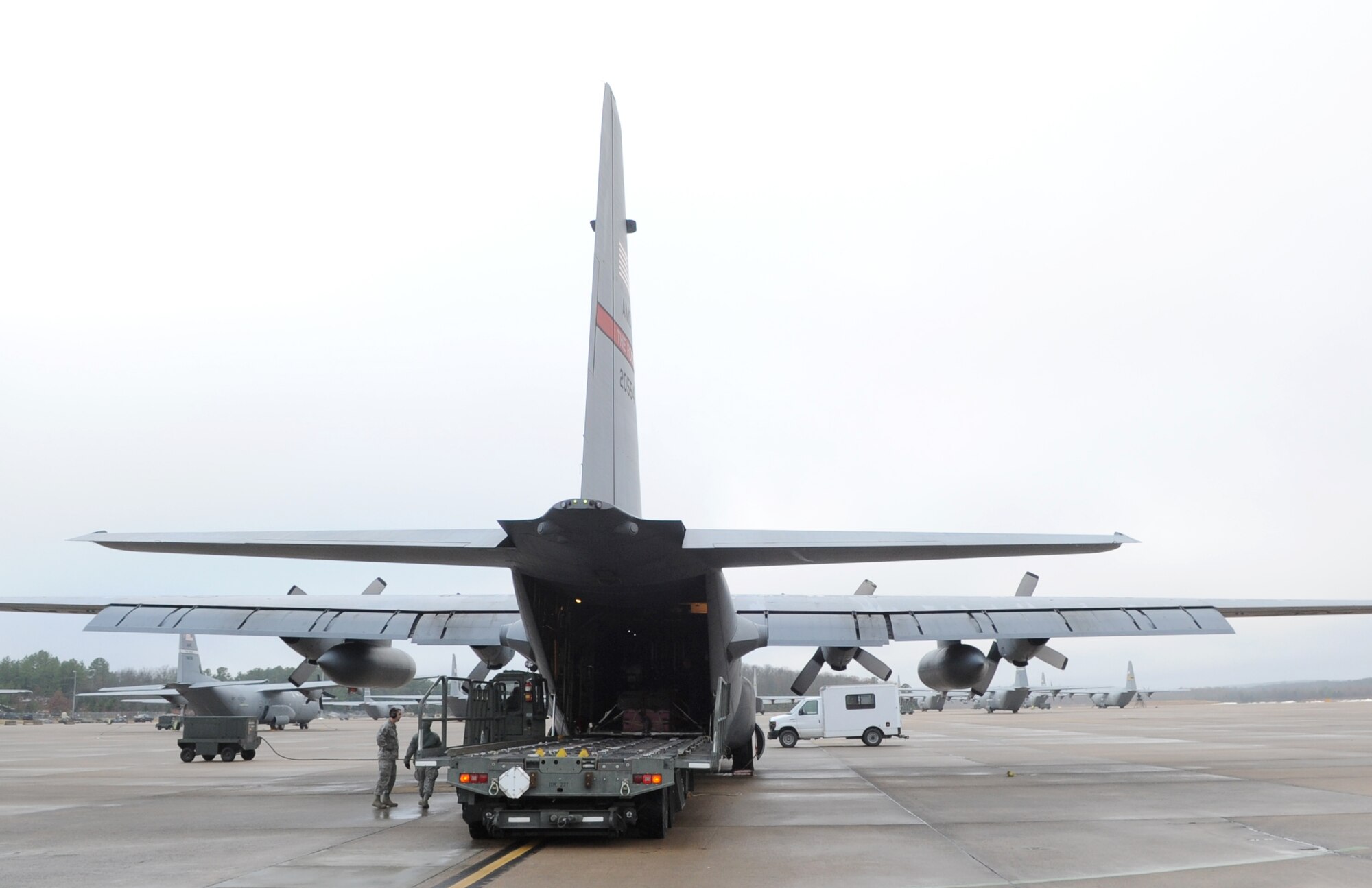 Airdrop pallets are loaded on a C-130 Super E prior to a sortie with the 50th Airlift Squadron and the 22nd Air Force Det. 1 Dec. 14, 2013, at Little Rock Air Force Base, Ark. Det. 1 is transitioning to become a combat-coded airlift group and continues working with active duty partners. (U.S. Air Force photo by Staff Sgt. Caleb Pierce)