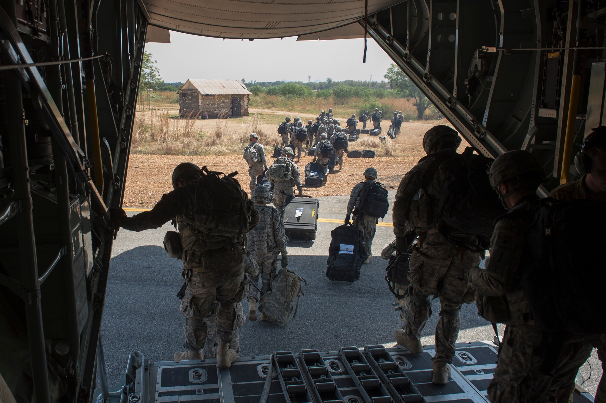 Soldiers of the East Africa Response Force travel depart an U.S. Air Force Reserve Command C-130 Hercules at Juba, South Sudan, to support with an ordered departure in Juba, South Sudan Dec. 18, 2013. At the request of the U.S. Department of State, the U.S. Defense Department directed two 302nd Airlift Wing C-130 aircraft to move personnel from Juba, the capital of South Sudan, to Nairobi, Kenya. DOD also augmented physical security at American diplomatic facilities in Juba with members of the EARF, a Djibouti-based joint team assigned to Combined Joint Task Force-Horn of Africa. (U.S. Air Force Tech. Sgt. Micah Theurich/Released)