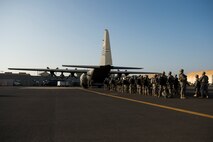 Soldiers of the East Africa Response Force load onto a U.S. Air Force Reserve Command C-130 Hercules at Camp Lemonnier, Djibouti, to support with an ordered departure in Juba, South Sudan Dec. 18, 2013. At the request of the U.S. Department of State, the U.S. Defense Department directed two U.S. C-130 aircraft from the 302nd Airlift Wing, Peterson AFB, Colo. to move personnel from Juba, the capital of South Sudan, to Nairobi, Kenya. DOD also augmented physical security at American diplomatic facilities in Juba with members of the EARF, a Djibouti-based joint team assigned to Combined Joint Task Force-Horn of Africa. (U.S. Air Force Tech. Sgt. Micah Theurich/Released)