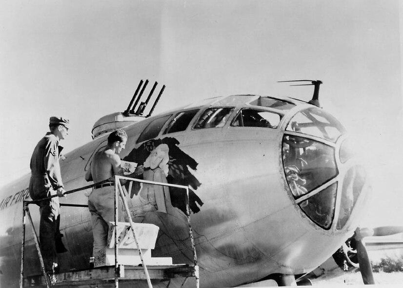 Airman John Alley, a cook by trade, tries his hand at painting a name and illustration on a 22d Bomb Group aircraft on a TDY to Japan during the Korean campaign. Some names adopted were: "Sad Sack," "SAC Mate," "Mission Inn" "Riverside Rambler," "Reddy," "Shezza Goer," "Peace Maker," "Miss Manuki" and "Mule Train." (Strategic Air Command archives)