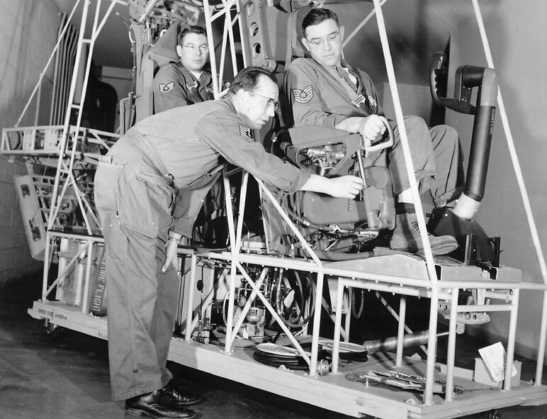 Crewmen of the all-jet B-52 have seat ejection systems for emergency escape. These men will be instructing Fairchild personnel in the proper method of emergency escape and mechanism maintenance. (Strategic Air Command archives)