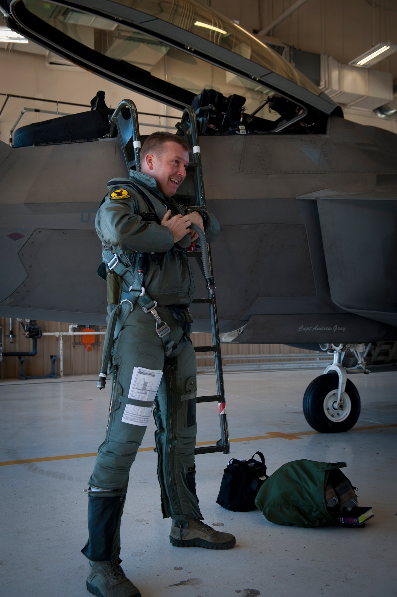 Lieutenant Colonel Shawn Anger, 7th Fighter Squadron commander, prepares to enter the cockpit of an F-22 Raptor at Holloman Air Force Base, N.M., Jan. 6. The first five of 24 combat-deployable F-22 Raptors left Holloman heading to Tyndall Air Force Base, Fla. as a permanent change of station. The five F-22s that left Jan. 6 will be followed by six Raptors leaving each month until the move is completed. (U.S. Air Force photo by Airman 1st Class Aaron Montoya)