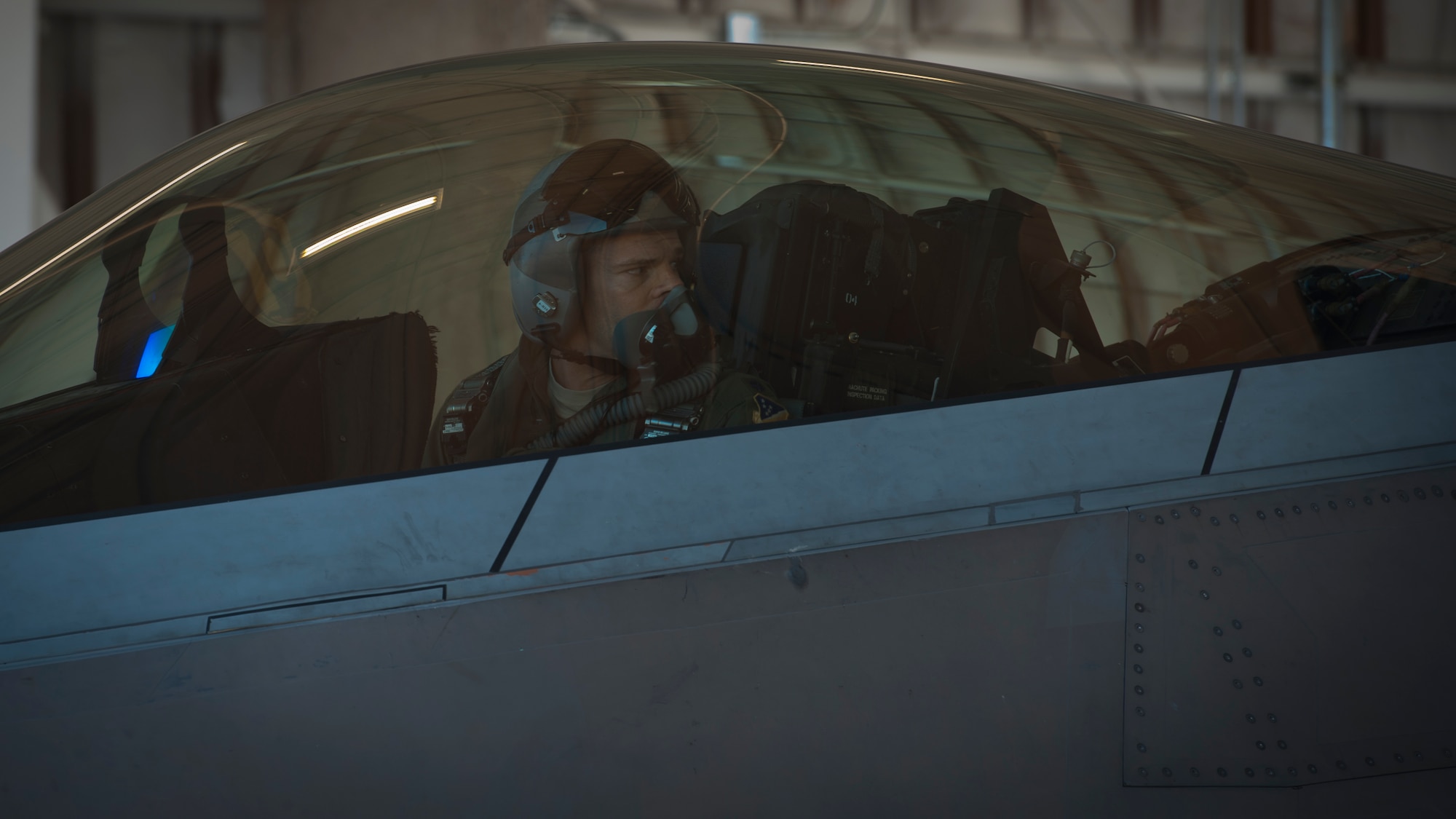 Lieutenant Colonel Jeremy Durtschi, 7th Fighter Squadron pilot instructor and evaluator, performs pre-flight checks and preparations in an F-22 Raptor at Holloman Air Force Base, N.M., Jan. 6. The first five of 24 combat-deployable F-22 Raptors left Holloman heading to Tyndall Air Force Base, Fla. as a permanent change of station. The five F-22s that left Jan. 6 will be followed by six Raptors leaving each month until the move is completed. (U.S. Air Force photo by Airman 1st Class Aaron Montoya)