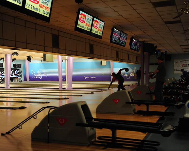 Patrons of Dyess Lanes partake in a game of bowling Jan. 7, 2014, at Dyess Air Force Base, Texas. Special events are held at the bowling alley at least once or twice a month and specials on food are presented daily. Dyess Lanes was recently recognized as the best bowling program in Air Combat Command. (U.S. Air Force photo by Senior Airman Kia Atkins/Released)