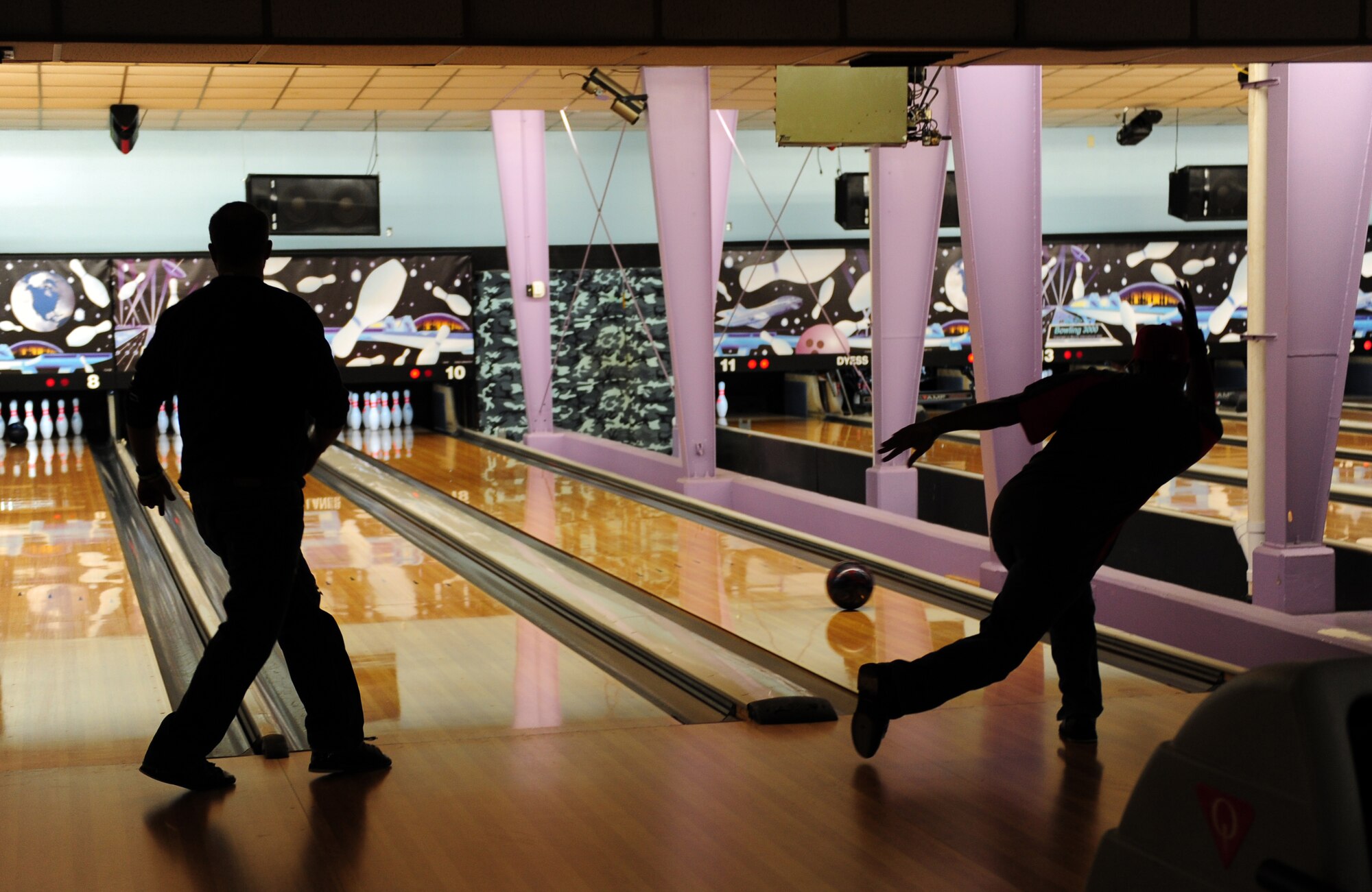 Patrons of Dyess Lanes partake in a game of bowling Jan. 7, 2014, at Dyess Air Force Base, Texas. On Dec. 5, 2013, the 7th Force Support Squadron’s Bowling Program was recently announced as the best in Air Combat Command. (U.S. Air Force photo by Senior Airman Kia Atkins/Released)