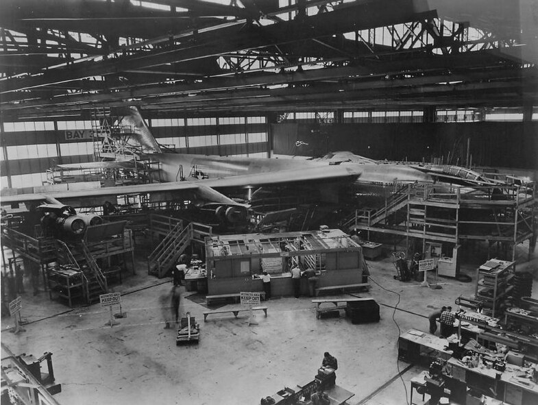 Boeing Airplane Company's first B-52 Stratofortress is shown here as it neared completion in the company's factory in November 1951. Note that the airpane's 48-foot-high tail has been folded so that it can be rolled out of the factory for taxi tests. Castle Air Force Base was scheduled to receive to the B-52 in 1955. (Strategic Air Command archives)
