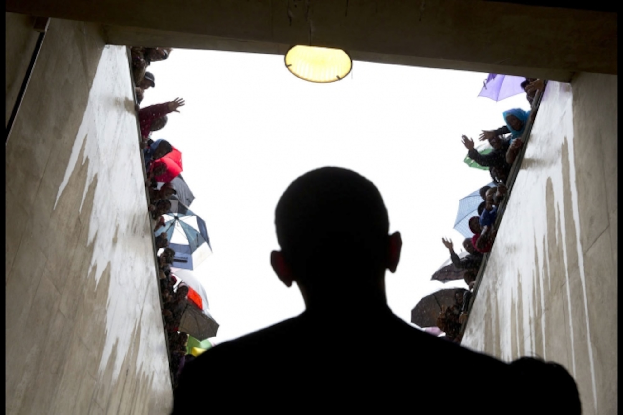 South Africans cheer as President Barack Obama waits in a tunnel at a soccer stadium in Johannesburg, South Africa, before taking the stage to speak at Nelson Mandela's memorial service. (Official White House photo by Pete Souza)