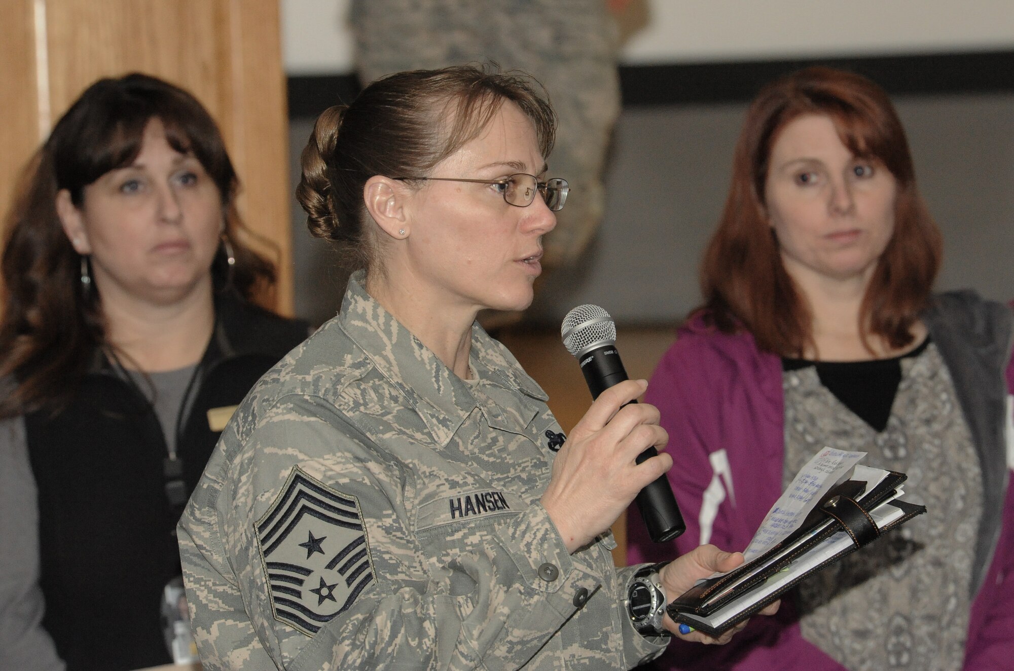 Chief Master Sgt. Wendy Hansen, 92nd Air Refueling Wing command Chief, addresses her airman’s concerns on the recent announcement of the Enlisted Retention Board during a town hall at Fairchild Air Force Base, Wash., Jan. 7, 2014. An enlisted retention board will be held in June to consider eligible senior airmen through senior master sergeants for retention in the Air Force. The retention board will review enlisted members records, consisting of enlisted performance reports, decorations and a retention recommendation form to select individuals for continued retention. The board will consider Airmen who are in overmanned Air Force specialties. (U.S. Air Force photo by Staff Sgt. Alexandre Montes/RELEASED)