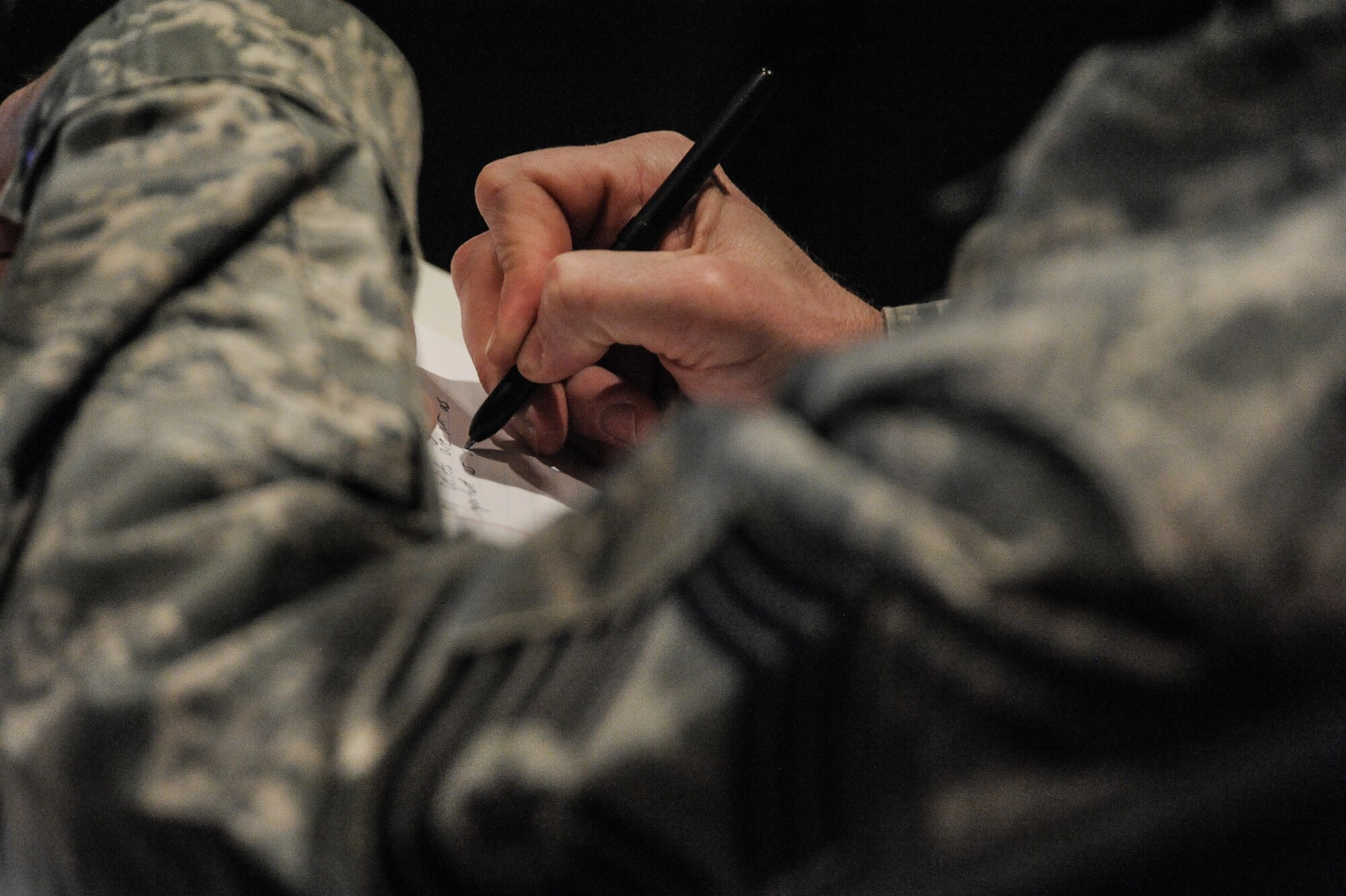Airmen from the ranks of Airman 1st Class to chief master sergeant attended the Air Force Enlisted Retention Board town hall for insight on what to expect and plan for in the next few months at Fairchild Air Force Base, Wash., Jan. 7, 2014. An enlisted retention board will be held in June to consider eligible senior airmen through senior master sergeants for retention in the Air Force. (U.S. Air Force photo by Staff Sgt. Alexandre Montes/RELEASED)