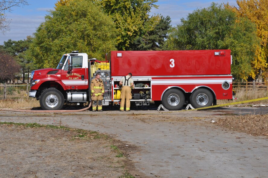 Firefighters from the Gowen Field Fire Department battled flames and smoke alongside Boise City firefighters in a “live-burn” exercise at an abandoned home turned training grounds in Boise, Idaho Nov. 1.   (Air National Guard photo by Staff Sgt. Matthew Harrington, Gowen Field firefighter)
