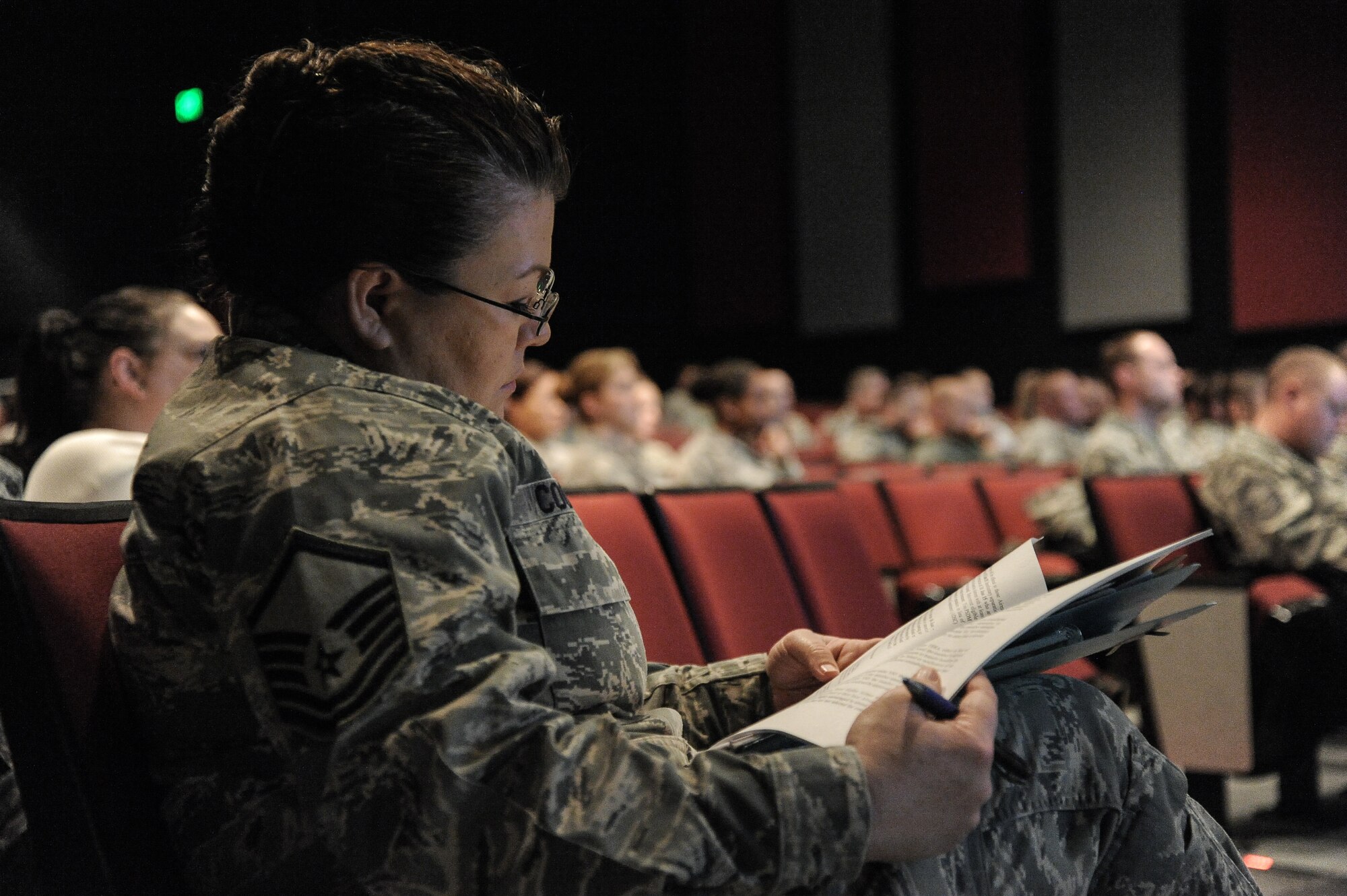 Master Sgt. Danita Coons, 92nd Military Personnel Flight superintendent, complies concerns while listening to briefers and Airmen at the Air Force Enlisted Retention Board town hall meeting at Fairchild Air Force Base, Wash., Jan. 7, 2014. An enlisted retention board will be held in June to consider eligible senior airmen through senior master sergeants for retention in the Air Force. (U.S. Air Force photo by Staff Sgt. Alexandre Montes/RELEASED)