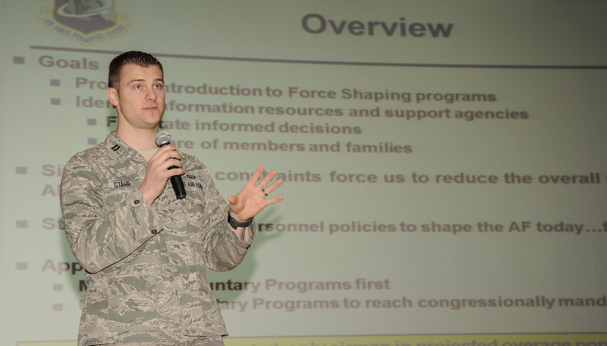 Capt. Carsten Stahr, 92nd Military Personnel Flight commander, opens ups the Enlisted Retention Board brief during a town hall to update and inform selected enlisted members for the retention board at Fairchild Air Force Base, Wash., Jan. 7, 2014. An enlisted retention board will be held in June to consider eligible senior airmen through senior master sergeants for retention in the Air Force. The retention board will review enlisted members records, consisting of enlisted performance reports, decorations and a retention recommendation form to select individuals for continued retention. The board will consider Airmen who are in overmanned Air Force specialties. (U.S. Air Force photo by Staff Sgt. Alexandre Montes/RELEASED)
