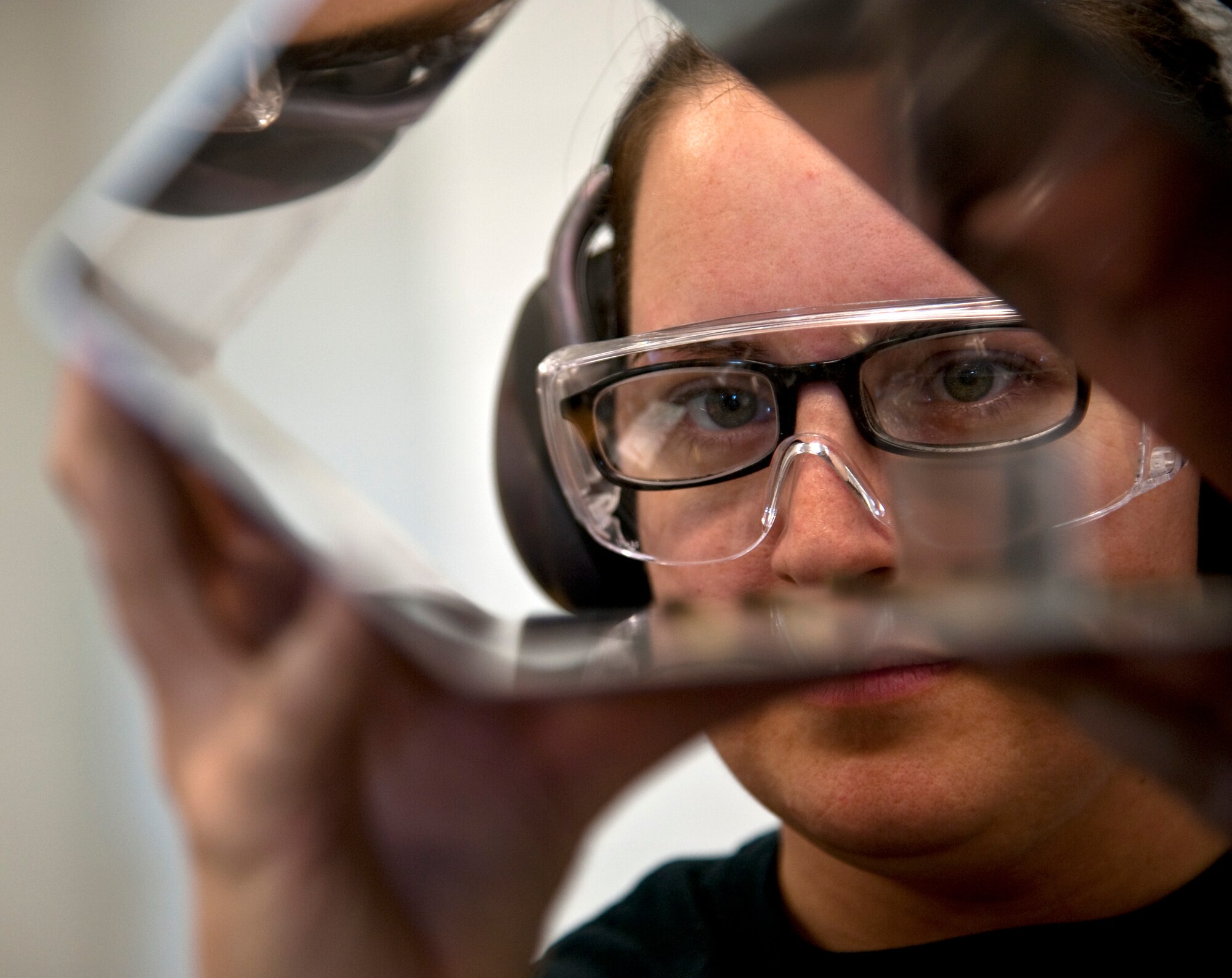 A Detachment 1, 359th Training Squadron aircraft structural maintenance instructor examines a student's rivet work at Naval Air Station Pensacola, Fla., Dec. 17, 2013. Instructors teach U.S. Airmen, as well as international students primarily from the Middle East, in trades which ensure aircraft are air-worthy. (U.S. Air Force photo/Senior Airman Michelle Vickers)
 