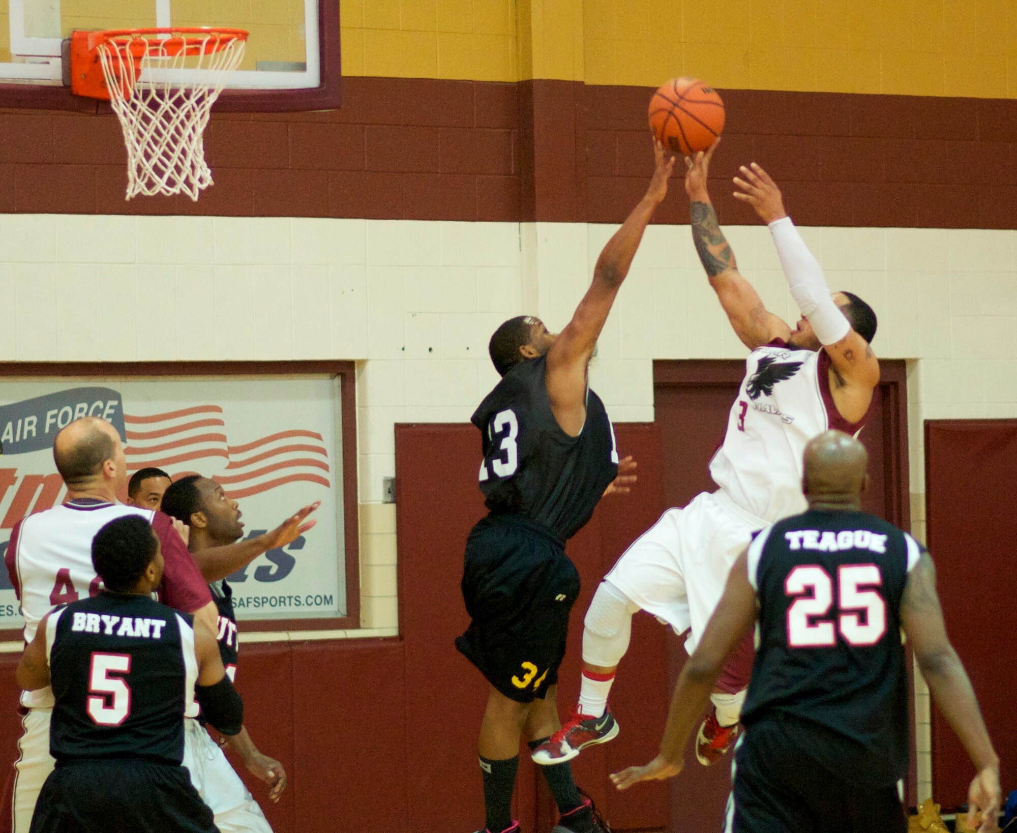 Team Offutt’s Avery Walker (#13) tries to block a shot by Tinker Hawk Jarail Smith (#3) Sunday afternoon. Watching are Offutt’s Derek Bryant (#5), Tinker’s Brian Johnston, Offutt player/coach Rodrick Greene, and Offutt’s Christian Teague (#25). Tinker won in overtime. (Air Force photo by Chad Jespersen)