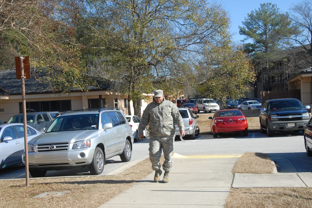 Tech. Sgt. Bruce Thompson, 78th Logistics Readiness Squadron, braves the cold to pick up a prescription, Wednesday, when temperatures dropped into the teens. (U. S. Air Force photo by Misuzu Allen)
