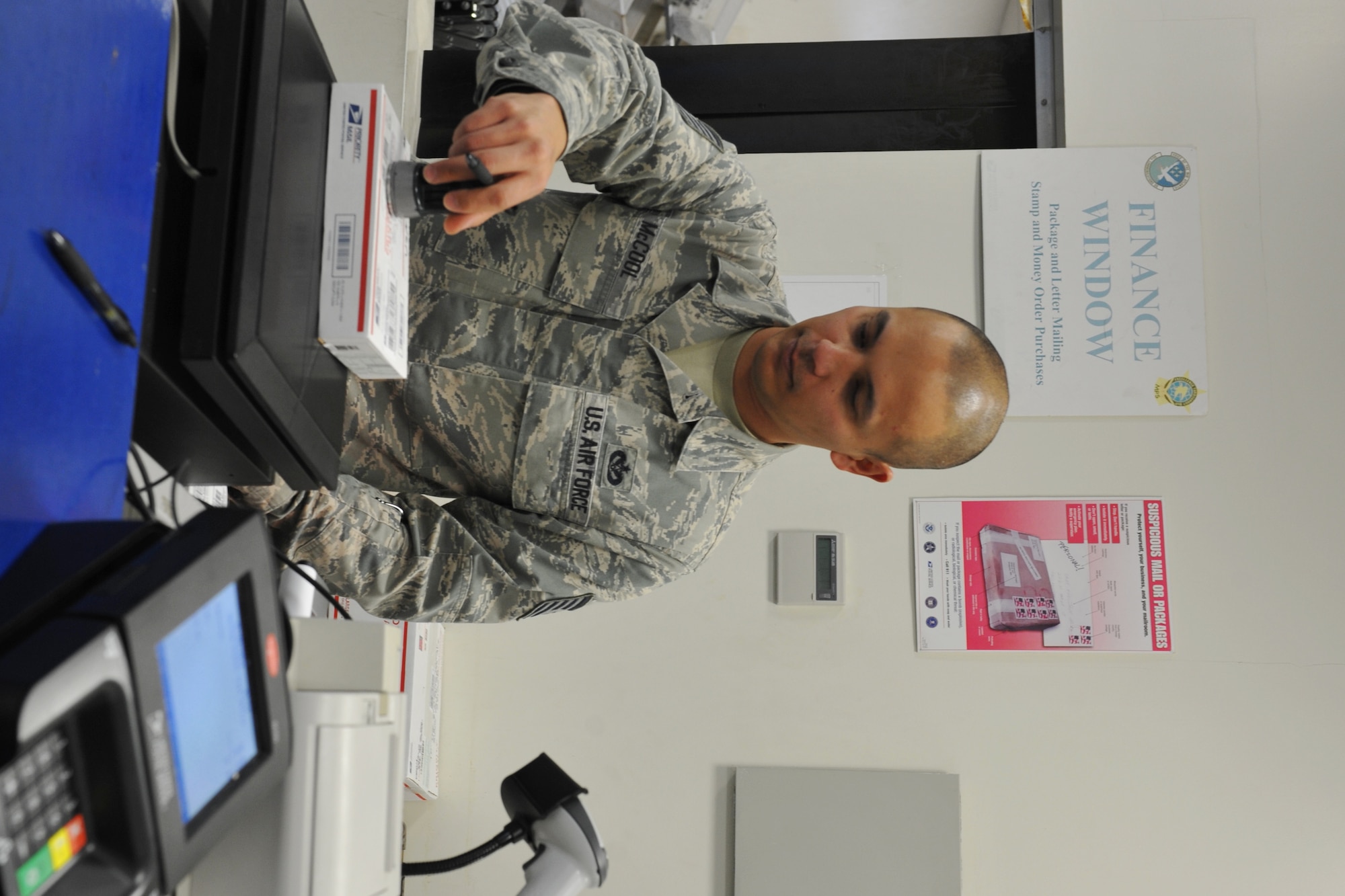 U.s. Air Force Tech. Sgt. Stephen McCool, 65th Communications Squadron postmaster, stamps an outgoing package at the Lajes Field Post Office Jan. 9, 2014. The 65th CS Postal Service team was recently awarded the Information Dominance Air Force Outstanding Small Postal Facility Award for 2013. (U.S. Air Force photo by Staff Sgt. Angelique N. Smythe)
