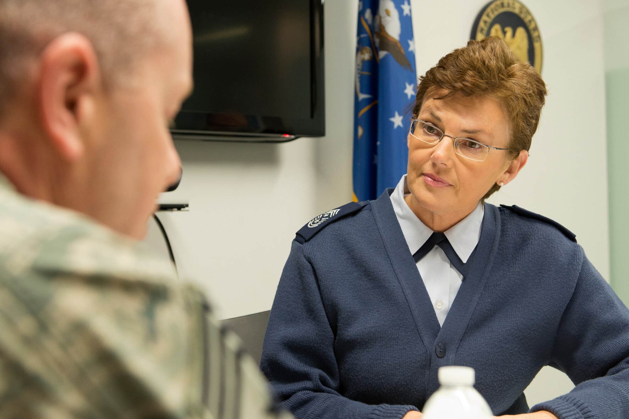 Chief Master Sgt. Victoria Gamble, command chief master sergeant for 18th Air Force, Scott Air Force Base, Ill., visits with Chief Master Sgt. Jim Hotaling, command chief master sergeant of the Air National Guard during an office call at Joint Base Andrews, Md., Jan 7, 2014. As the command chief of 18th AF, Gamble serves as the primary adviser to the commander on matters concerning mission effectiveness, readiness, training, health welfare, and morale of personnel assigned to the command's 11 wings, the 618th Tanker Airlift Control Center, and two stand-alone groups. (U.S. Air National Guard photo by Master Sgt. Marvin R. Preston/Released)