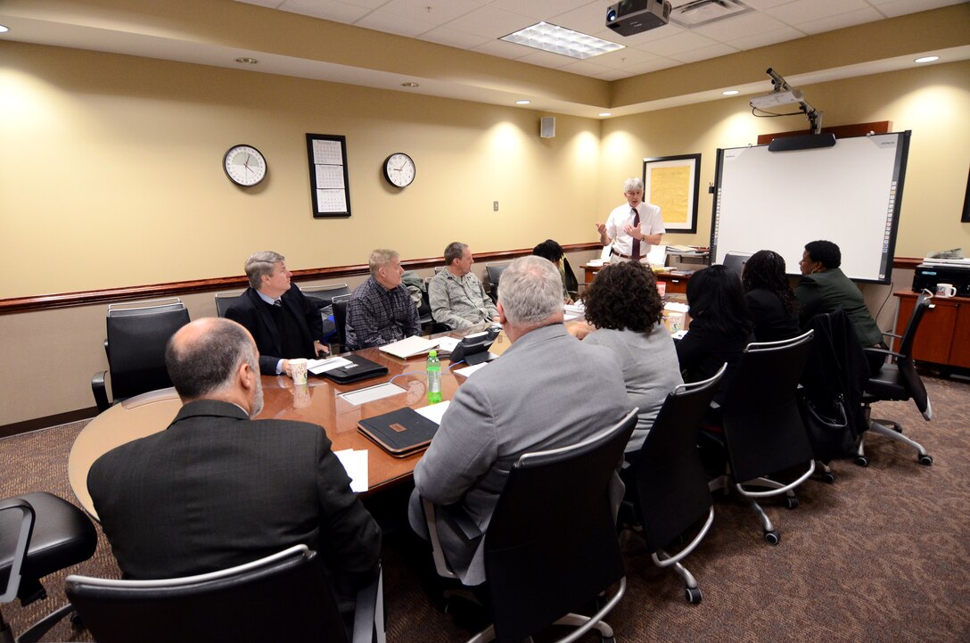 Melvin Smith, 94th Airlift Wing chief of contracting, discusses issues with fourteen Atlanta and Warner Robins area government contracting agency leaders during the quarterly Heads of Contracting Activity meeting Jan. 8. The HCA meeting serves as a platform for Air Force Reserve Command, Warner Robins Air Logistics Complex, Center for Disease Control and Prevention, Housing and Urban Development, Small Business Administration and Dobbins Air Reserve Base chiefs of contracting to discuss resource issues, ideas and best practices. (U.S. Air Force photo/Brad Fallin)