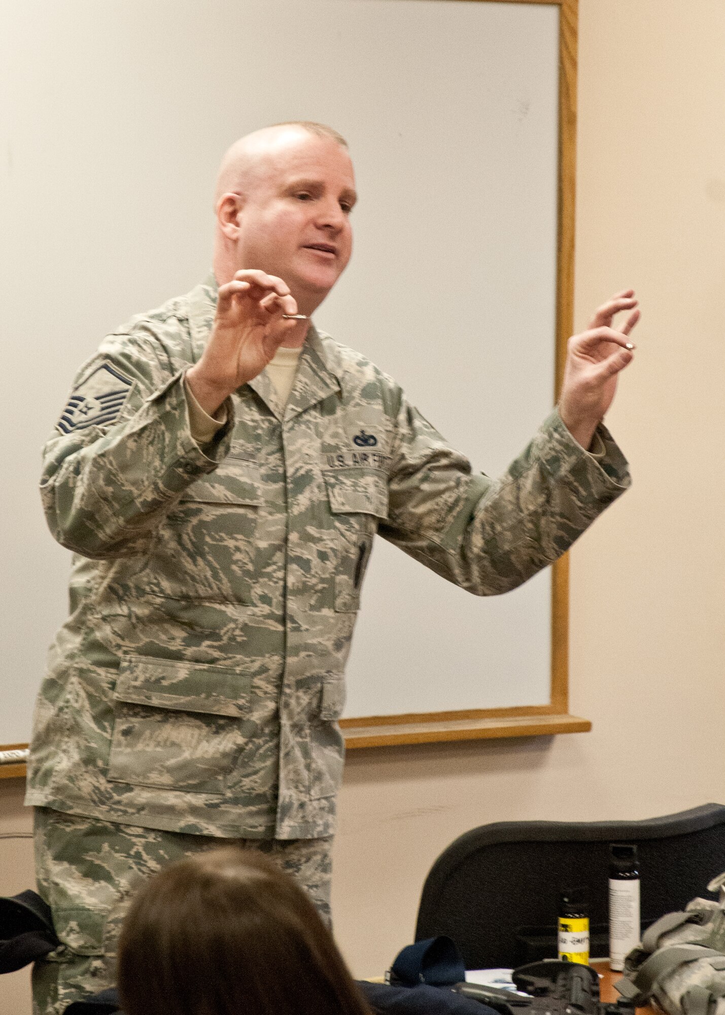 Master Sgt. Sean Dias, of the 102nd Security Forces Squadron, displays two Taser probes for students from Sandwich Highschool on Otis Air National Guard base, December 12, 2013. The students training was part of a law enforcement class and included a lecture on law enforcement tools and the use of situation simulator which trains people how to react when faced with different scenarios. (National Guard photo by Master Sgt. Aaron Smith/Released)