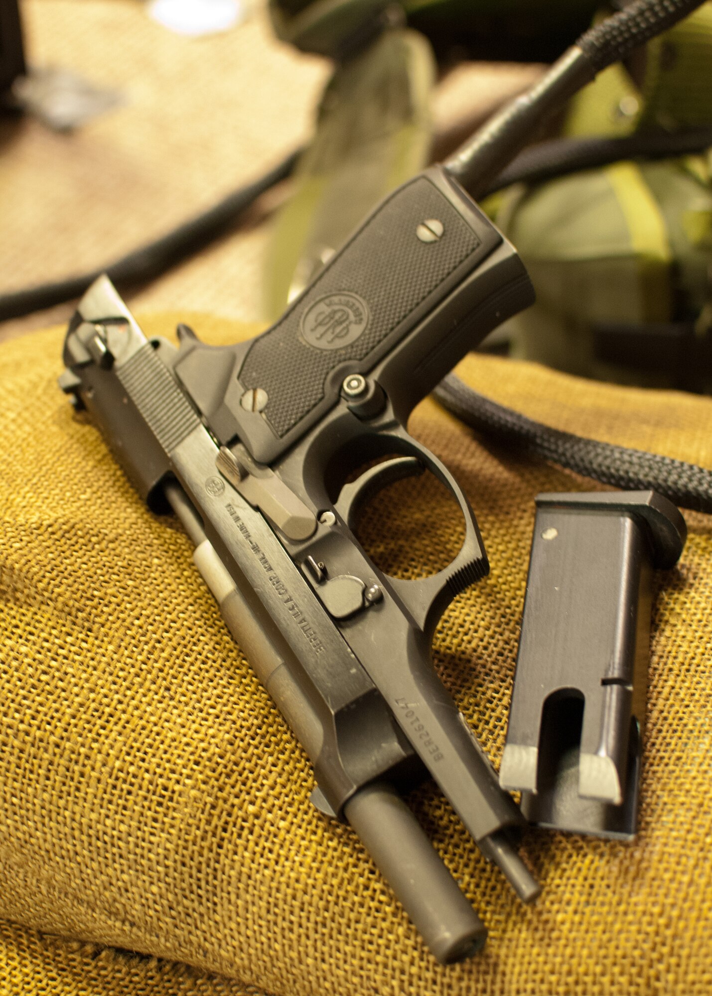 A training firearm lies on the floor of the 102nd Security Forces Fire Arm Training Simulator on Otis Air National Guard base, December 12, 2013. The realistic, but inert, handgun is a  is part of a simulator that trains users on how to react when facing with different law enforcement scenarios. (National Guard photo by Master Sgt. Aaron Smith/Released)