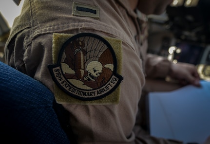 The 816th Expeditionary Airlift Squadron patch is displayed on the shoulder of 1st Lt. Zach White aboard a C-17 Globemaster III at Al Udeid Air Base, Qatar, Jan. 9, 2014. The 816th EAS is responsible for providing strategic airlift and combat operations to the U.S. Air Forces Central Command’s area of responsibility. The Airmen assigned to the 816th EAS, who are deployed from Joint Base Charleston, S.C., have flown more than130 sorties, moved more than 4 million pounds of cargo and more than 1,700 passengers in the past two weeks alone. White is a pilot who hails from Bethel, Conn. (U.S. Air Force photo/Senior Airman Jared Trimarchi)  