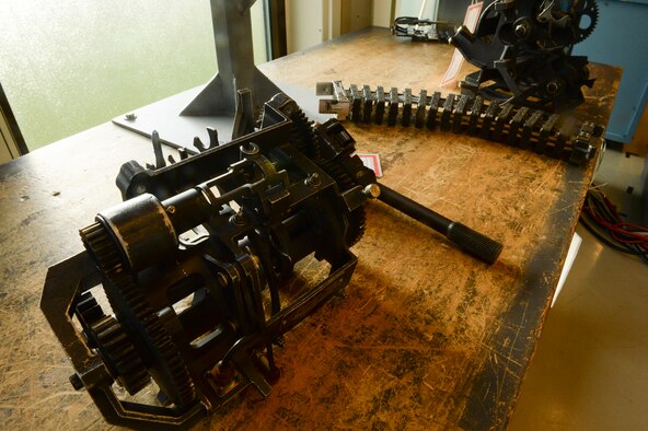 SPANGDAHLEM AIR BASE, Germany – An F-16 Fighting Falcon's gun parts are displayed on a table inside one of the bays at the 372nd Training Squadron Detachment 17 Jan. 7, 2014. The students going through the flightline weapons course learn how to safely remove the F-16 gun.  (U.S. Air Force photo by Senior Airman Rusty Frank/Released)