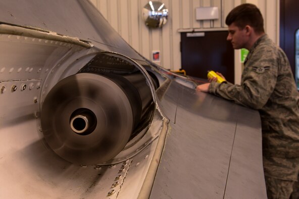 SPANGDAHLEM AIR BASE, Germany -- An F-16 Fighting Falcon fighter aircraft gun spins during a flightline weapons course inside a bay at the 372nd Training Squadron Detachment 17 Jan. 17, 2014. The detachment offers more than 70 courses including the flightline weapons course. (U.S. Air Force photo by Senior Airman Rusty Frank/Released)