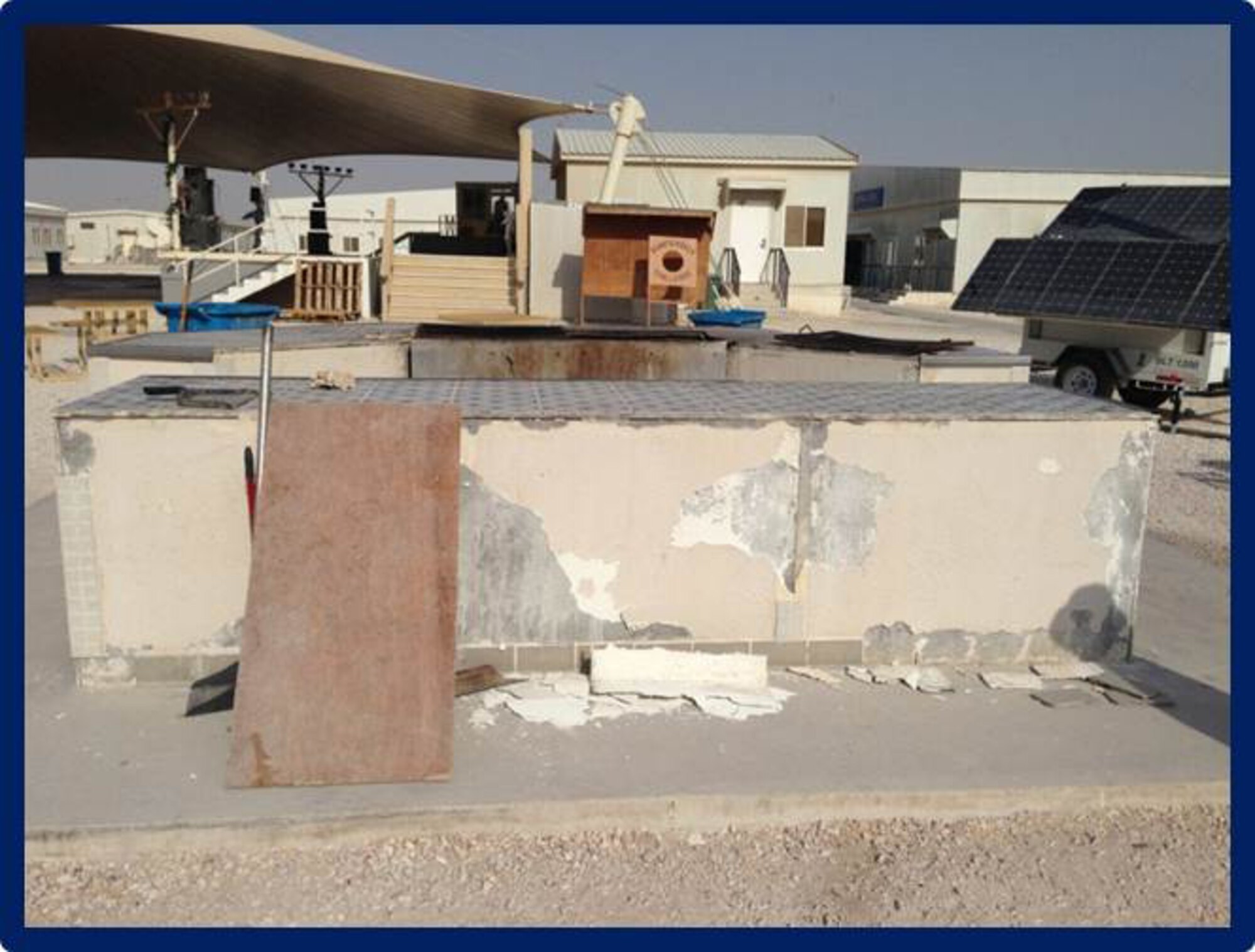 Members of the Top Three and 16 volunteer Airmen took initiative to refurbish a grill at Memorial Plaza at Al Udeid Air Base, Qatar, Dec. 23, 2013, as a part of the 2013 Legacy Project. The project began on Dec 25, 2013 and was completed in five days total time. The Top Three is a professional organization that fosters the AUAB community through the interaction and camaraderie of its members.  The group promotes morale, esprit de corps and professional development, through volunteer opportunities, award programs, professional development seminars and encourage Airmen to take ownership and leave AUAB better then they found it. (U.S. Air Force photo/Tech. Sgt. Damian Davies)