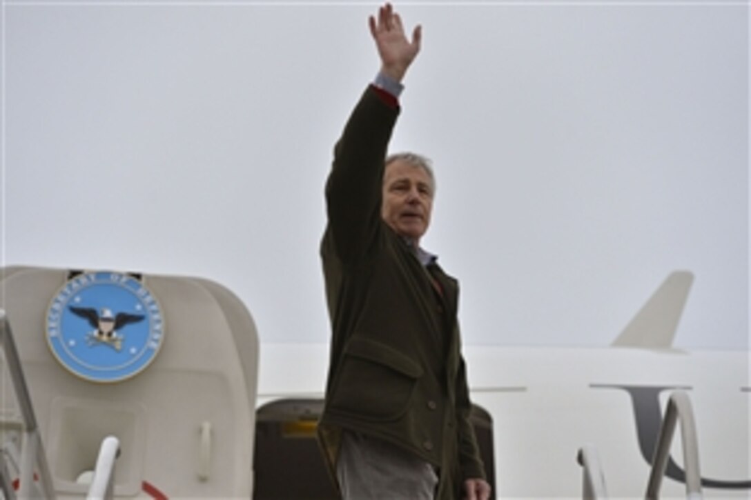 Defense Secretary Chuck Hagel waves goodbye as he departs F.E. Warren Air Force Base in Cheyenne, Wyo., Jan. 9, 2014.  