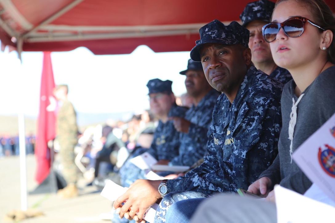 Rear Adm. Fernandez “Frank” Ponds, Expeditionary Strike Group 3 commander, looks on as Marines are called to attention during the 11th Marine Expeditionary Unit’s composite ceremony on Camp Pendleton, Calif. Jan. 11. The ceremony marks the beginning of a rigorous training schedule and subsequent deployment.