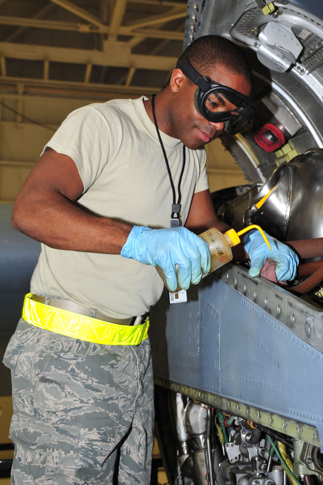 KEESLER AIR FORCE BASE, Miss. – Airman 1st Class Robert Ricks, 403rd Maintenance Squadron aerospace propulsion specialist, cleans the engine of a C-130J aircraft while checking it for foreign object damage Jan. 11, 2014. 403rd MXS members inspected the aircraft in the 403rd Wing’s Isochronal-inspection Dock as part of an annual Federal Aviation Administration requirement. (U.S. Air Force photo/Tech. Sgt. Ryan Labadens)