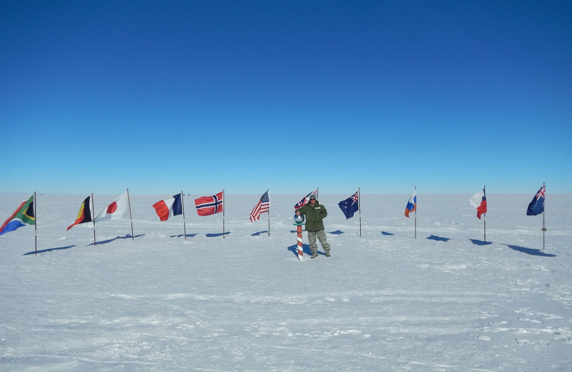 A picture of U.S. Air Force Tech. Sgt. Greg Mascaro posing for a photo at the South Pole.