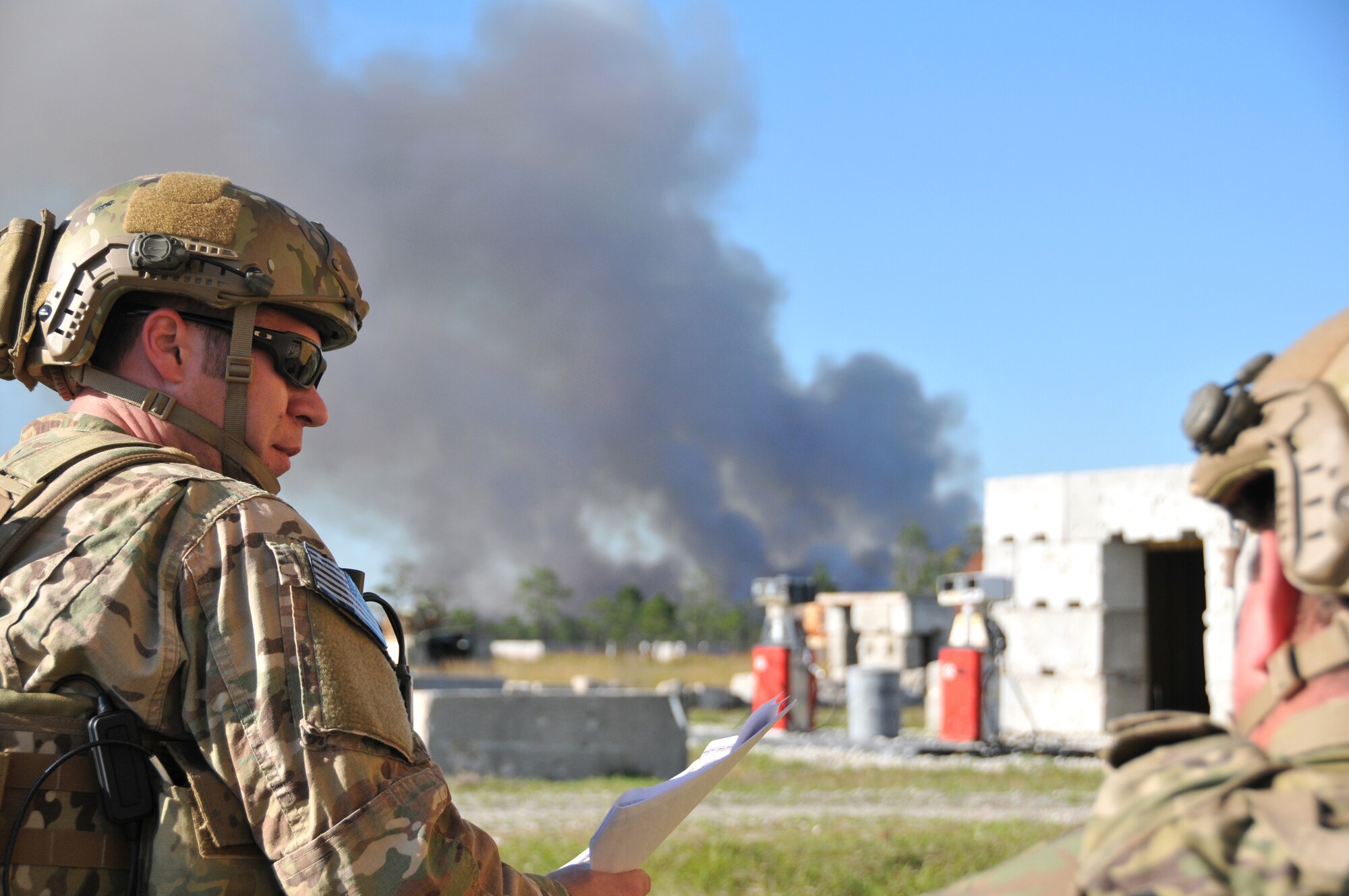 A member from the from the 147th Reconnaissance Wing Air Support Operations Squadron during a close air support training exercise at Avon Park Air Force Range, Fla., December 16, 2013. Perfoming exercises at the Florida range allows the airmen to hone the skills to perform their jobs in an environment that allows for the use of live aircraft and munitions to replicate real-life warfighting scenarios.