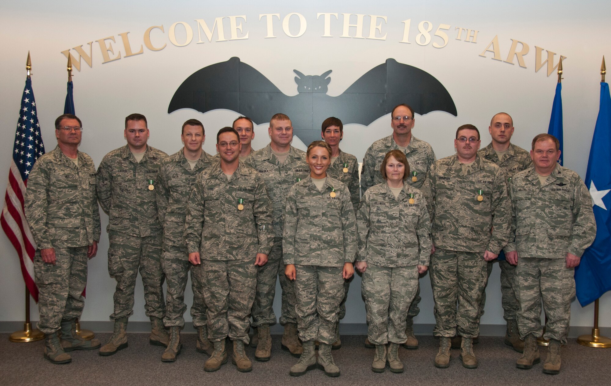 Members of the 185th Air Refueling Wing honored at a January 11, 2014 ceremony in Sioux City, IA for earning Associates degrees from the Community College of the Air Force in 2013. Colonel Brian Miller commander of the 185th and Brig. General Derek Hill the Iowa Air National Guard’s Assistant Adjutant General awarded each unit member with the Iowa National Guard Commendation Medal.