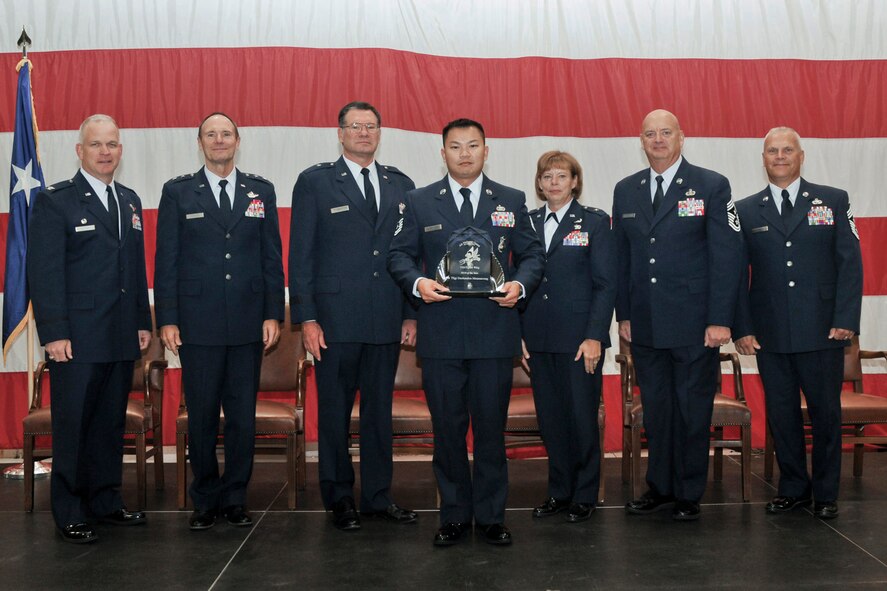 Tech. Sgt. Daobandon Meunsaveng is awarded the 2013 NCO of the Year award at the Annual Awards Ceremony held in the hangar of the 132nd Fighter Wing, Des Moines, Iowa on Saturday, November 2, 2013.  (U.S. Air National Guard photo by Staff Sgt. Linda K. Burger/Released)