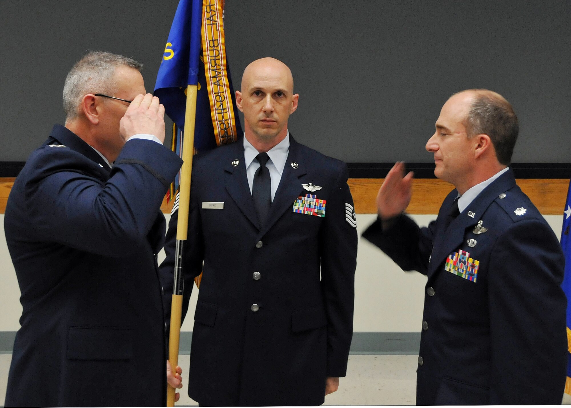 Col. Jonathan M. Philebaum, 512th Operations Group commander, presides as Lt. Col. Thomas Guerra assumes command of the 326th Aerial Port Squadron, Jan. 11, 2014, Dover AFB, Del. Guerra addressed Liberty Wing members regarding the importance of taking care of the people in order to accomplish the mission. (U.S. Air Force photo/Senior Airman Erika Brooke)