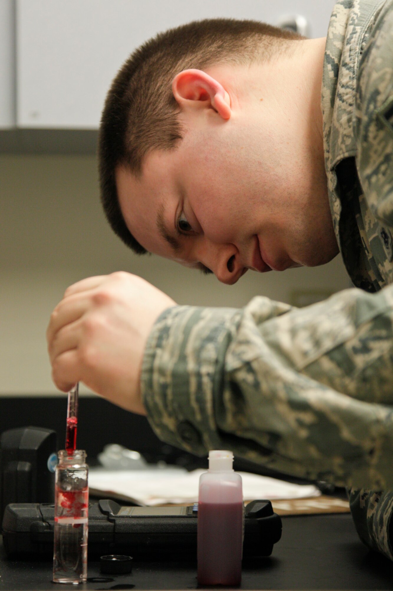 140111-Z-NJ721-029  Senior Airman Brandon Reif, 127th Medical Group, demonstrates a water quality test to measure for proper chemical balance and any impurities on Jan. 11, 2014, at Selfridge Air National Guard Base, Mich.  The tests are conducted monthly at key locations around the base to ensure quality drinking water.  (U.S. Air National Guard photo by TSgt. Robert Hanet/Released)