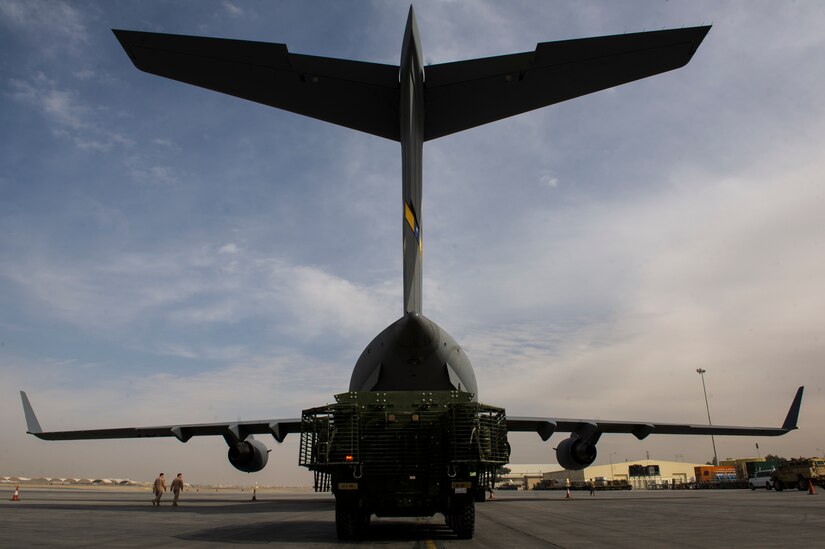 A C-17A Globemaster III with the 817th Expeditionary Airlift Squadron receives cargo at Kandahar Airfield, Afghanistan,  Jan. 3, 2014. The C-17A is deployed from Joint Base Charleston, S.C., and is part of the 405th Air Expeditionary Group's mission while deployed. The 405th AEG supports U.S. Central Command's Deployment and Distribution Operation Center, a strategically located air, land and sea logistics hub, playing a critical role in the U.S. departure from Afghanistan. (U.S. Air Force photo by Staff Sgt. Stephany Richards)
