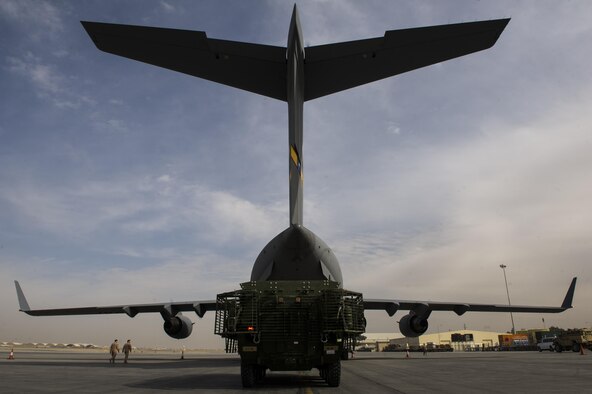 A C-17A Globemaster III with the 817th Expeditionary Airlift Squadron receives cargo at Kandahar Airfield, Afghanistan, Jan. 3, 2014. The C-17A is deployed from Joint Base Charleston, S.C., and is part of the 405th Air Expeditionary Group's mission while deployed. The 405th AEG supports U.S. Central Command's Deployment and Distribution Operation Center, a strategically located air, land and sea logistics hub, playing a critical role in the U.S. departure from Afghanistan. (U.S. Air Force photo by Staff Sgt. Stephany Richards) 

