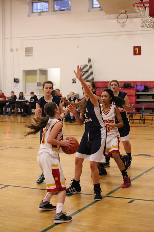 The Quantico Lady Warriors battle the Holy Family Academy Vendeens during a game at Quantico Middle/High School on Jan. 7, 2014. The Warriors beat the Vendeens 61-50.
