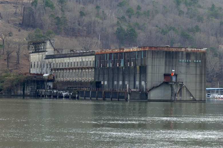 This is the Hales Bar Dam power plant building in Haletown, Tenn., taken from across the Tennessee River at the crumbling navigation lock Dec. 19, 2013 on the bank of the Tennessee River in Jasper, Tenn.  Hales Bar Dam opened in 1913 and the project was the first to provide hydropower in the world. The dam ceased operations in 1968 when Nickajack Dam opened a few miles downstream.  One hundred years later the region looks back and remembers life at Hales Bar Dam and Navigation Lock.